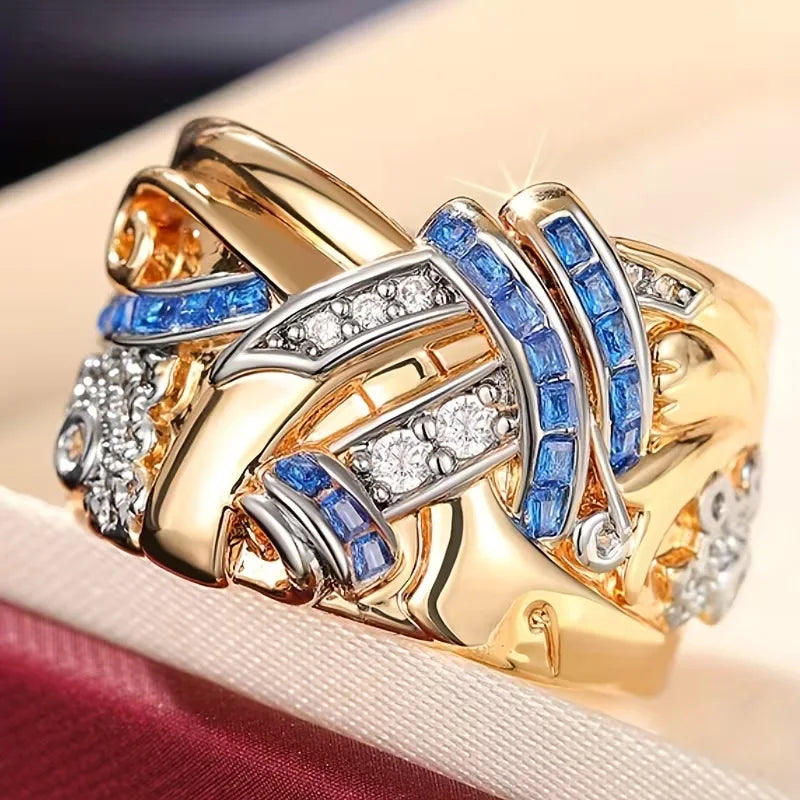 SELENE™ - WIDE FLOWER RING WITH BLUE ZIRCONIA