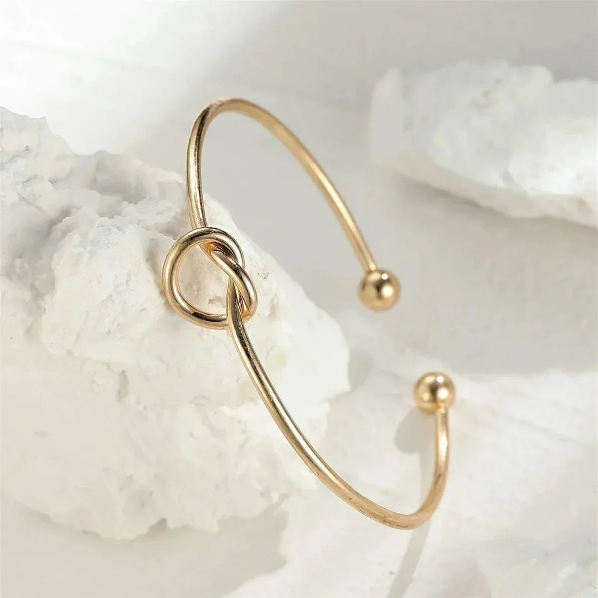 Antaradus - Golden Bracelet with Knot Detail